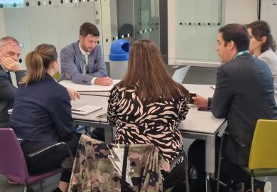 Group of people working around a table