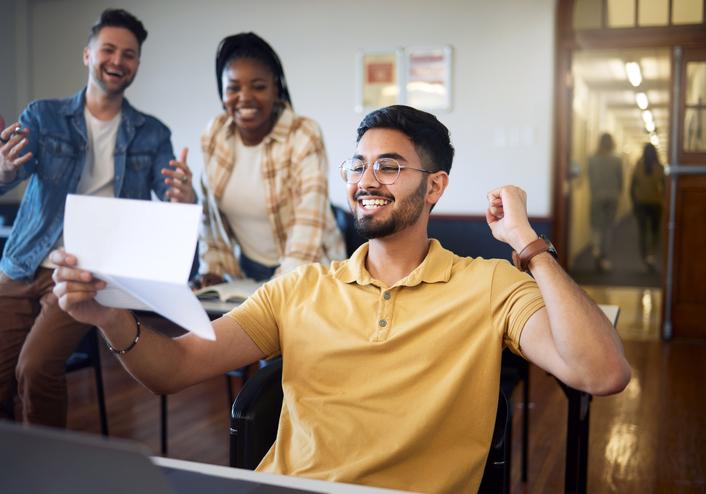 Success, celebration and students with results / iStock