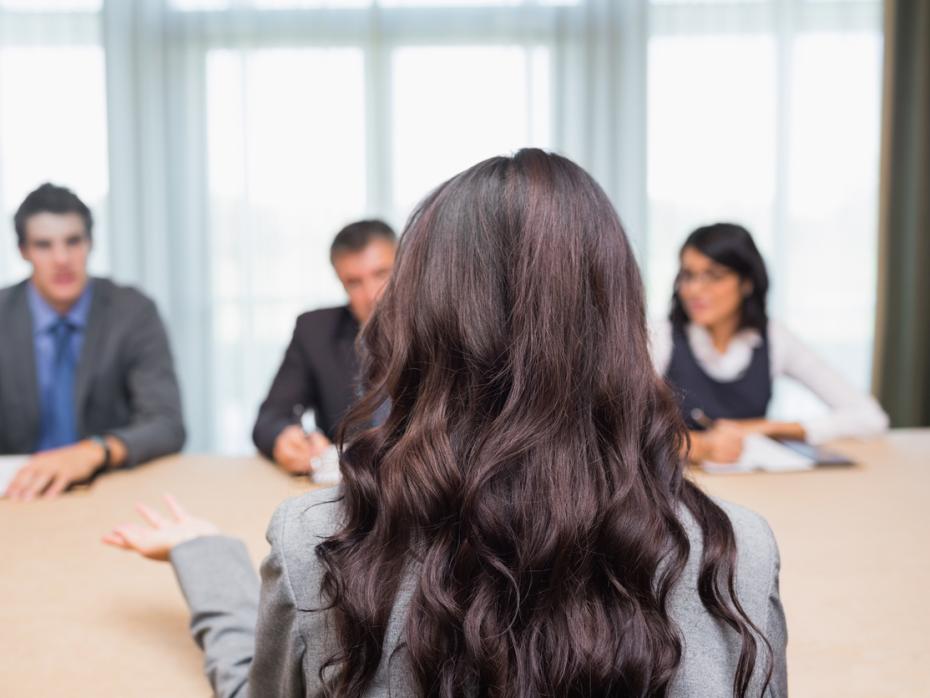 A woman being interviewed in a panel