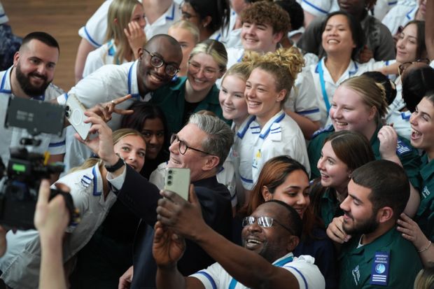 Labour leader Keir Starmer takes a selfie with students  in Worcester, United Kingdom to illustrate University staff overwhelmingly back Labour – with reservations